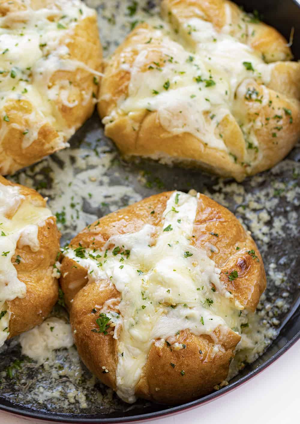 Cheesy Garlic Bread in a Red Skillet shot from Overhead Looking into Pan