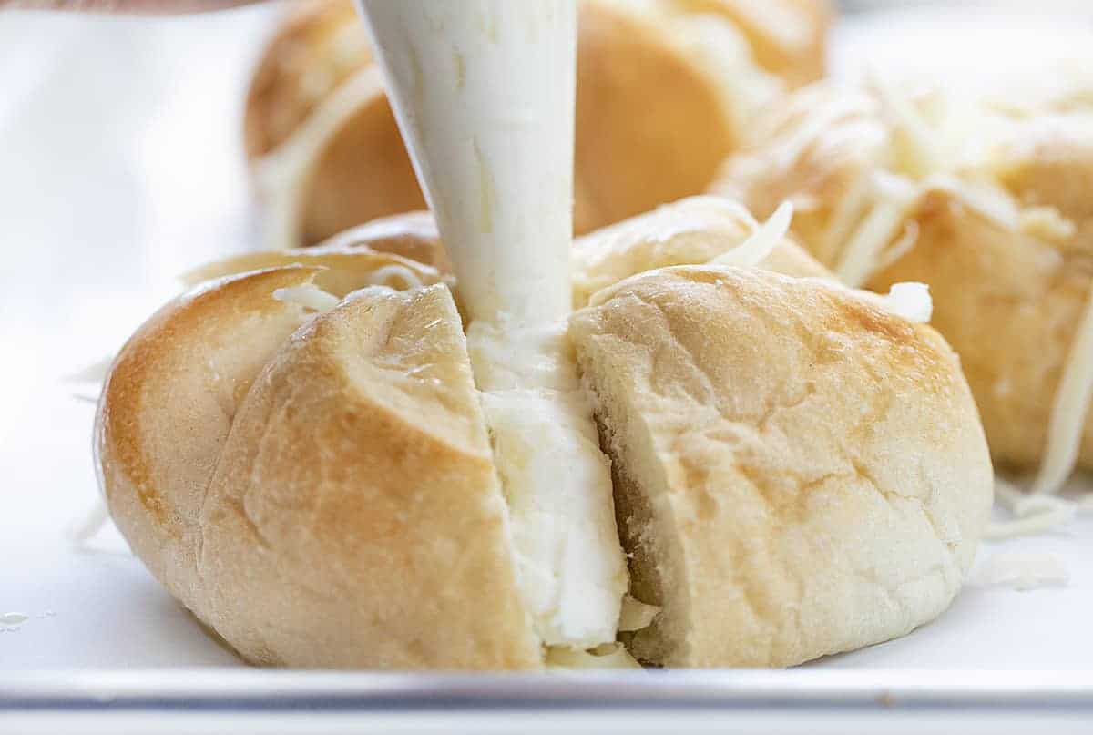 Adding Cream Cheese to Roll to Make Cheesy Garlic Pull Apart Bread