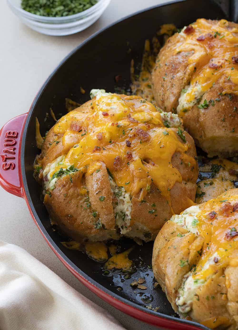 Jalapeno Popper Cheesy Pull Apart Bread in a Red Skillet Showing Gooey Cheese