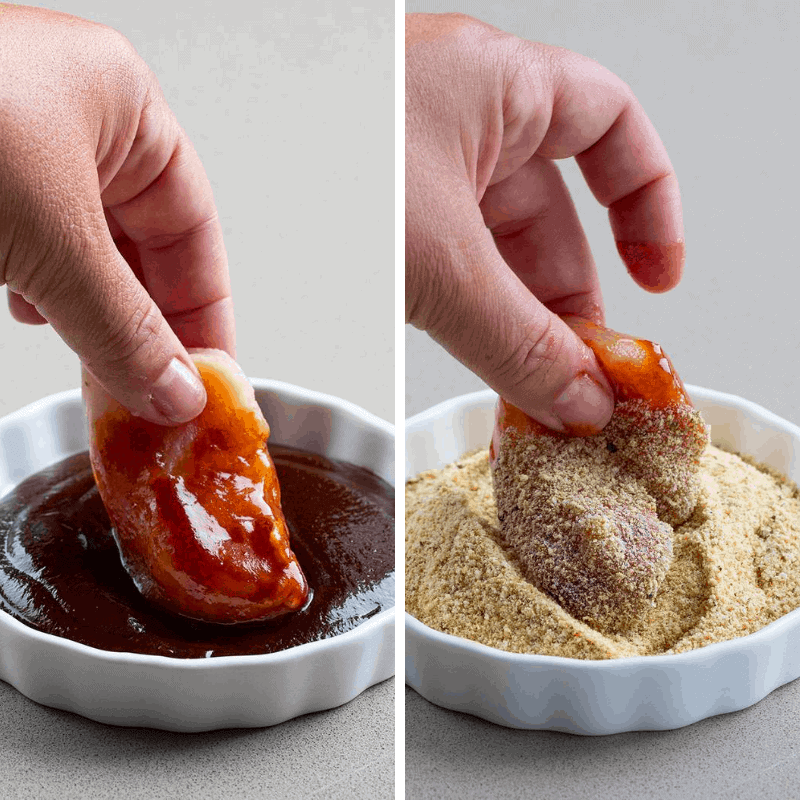 Hand Dipping Raw Chicken into BBQ and then Dipping into Crumbs