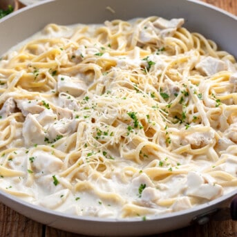 Skillet of Creamy Chicken Pasta on a table.