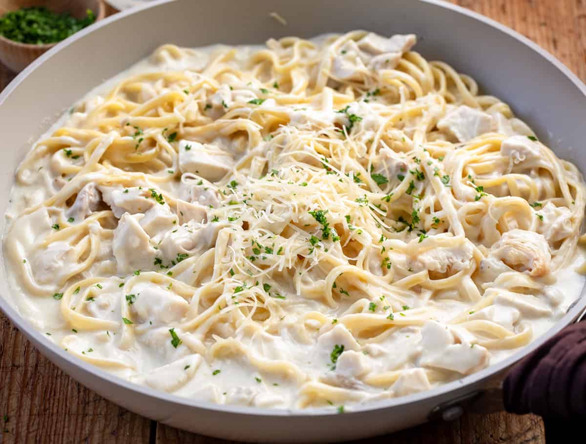 Skillet of Creamy Chicken Pasta on a table.