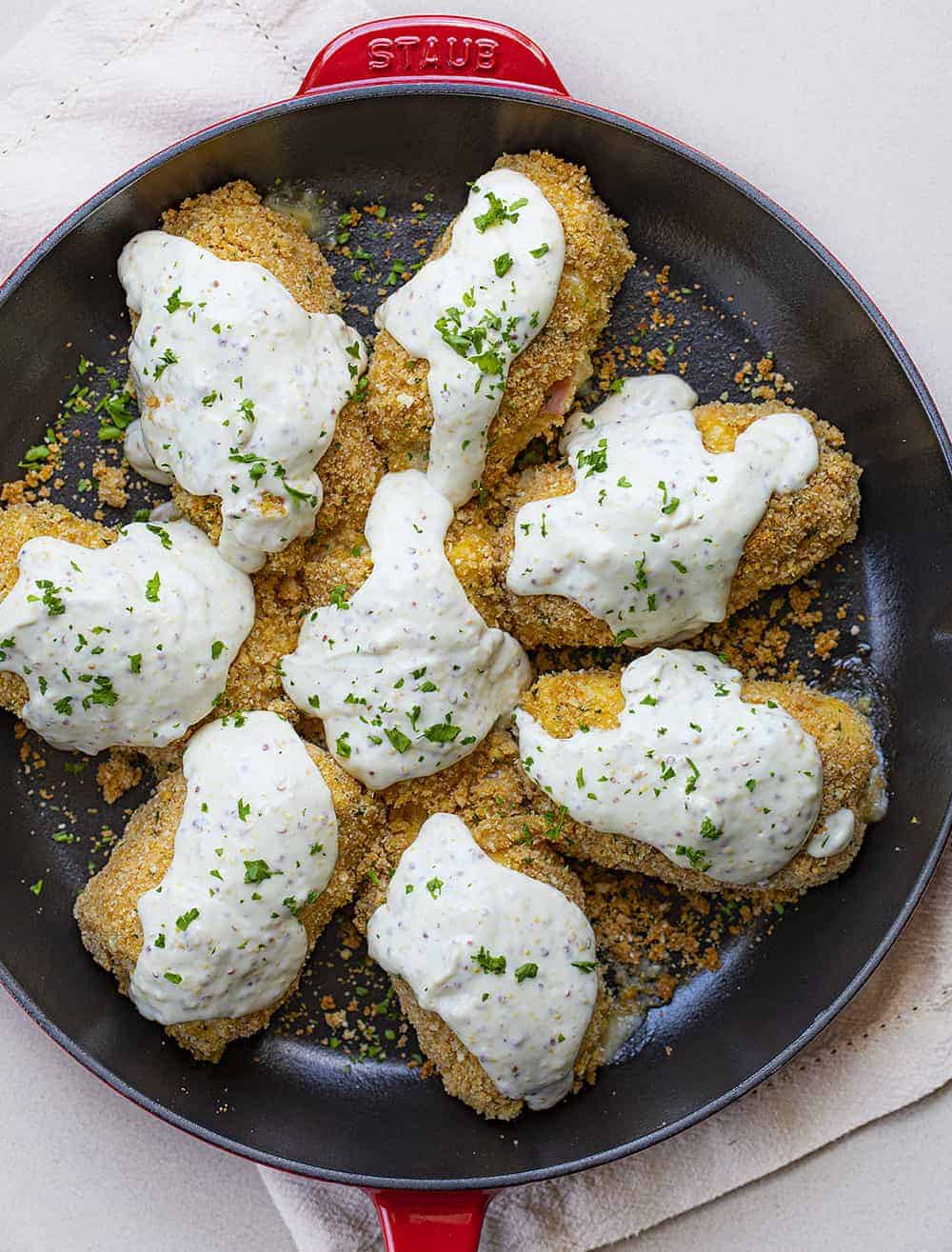 Overhead view of Baked Chicken Cordon Bleu in Red Skillet