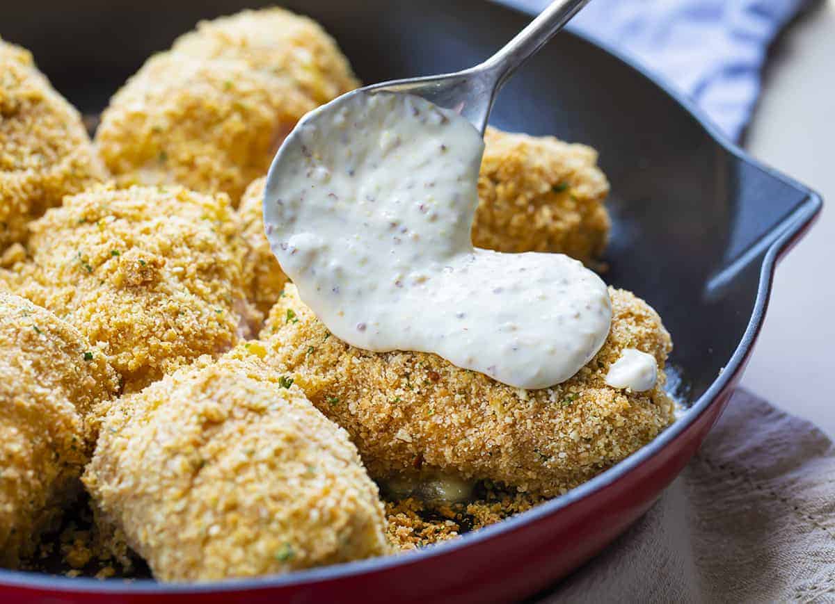 Adding Sauce to Just Baked Chicken Cordon Bleu 