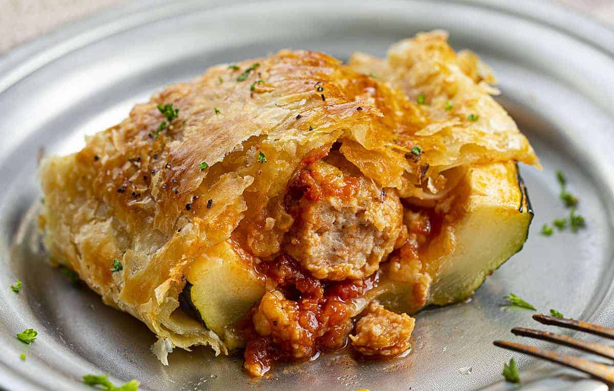 One Piece of Meatball Zucchini Boat Covered in Puff Pastry