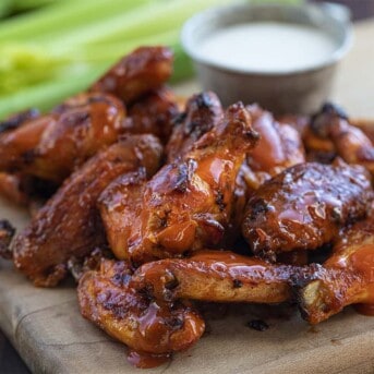 plate of buffalo chicken wings with dressing for dipping