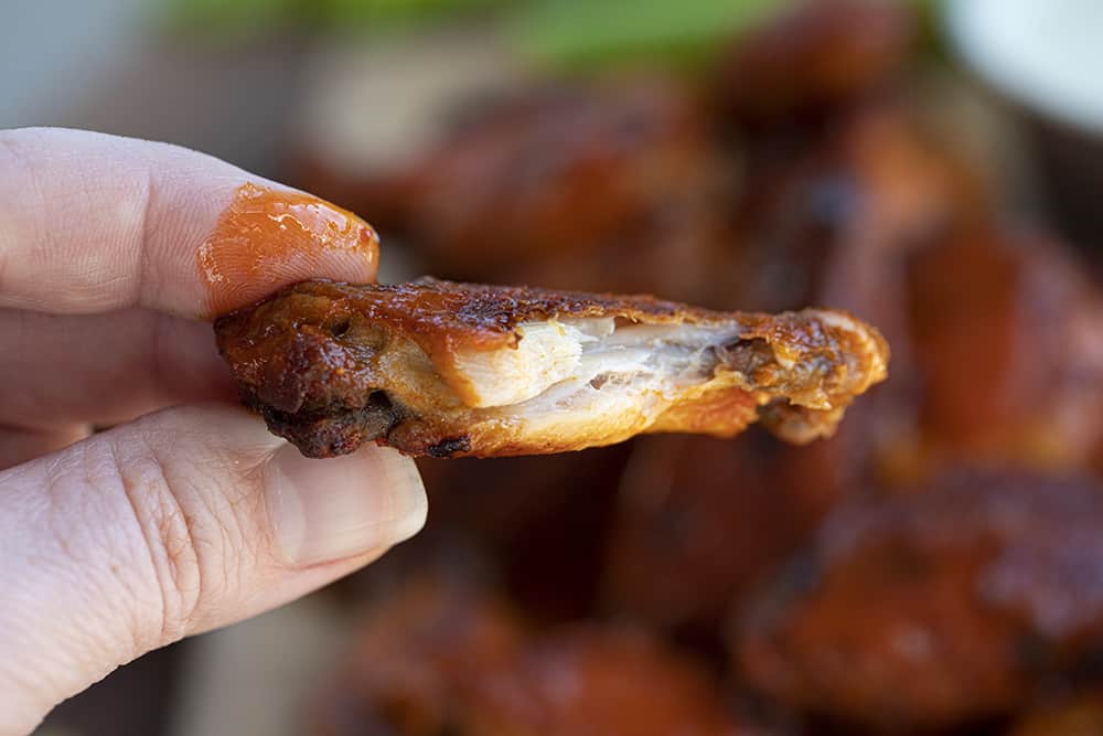 Hand holding Buffalo Chicken Wing