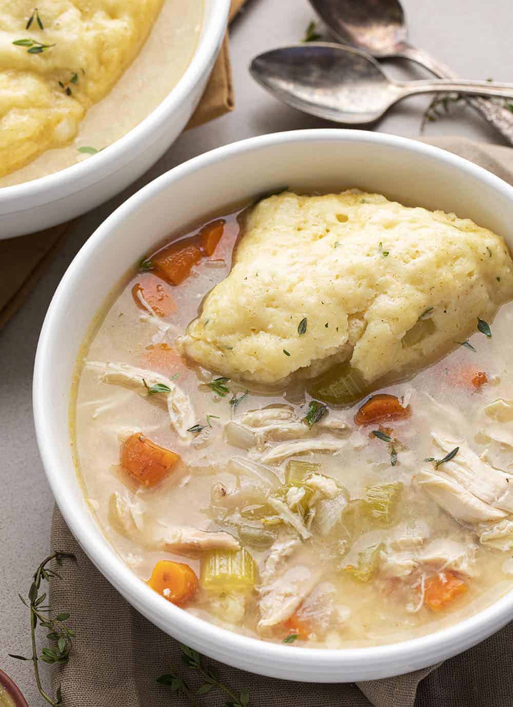Old Fashioned Chicken and Dumplings in Two White Bowls