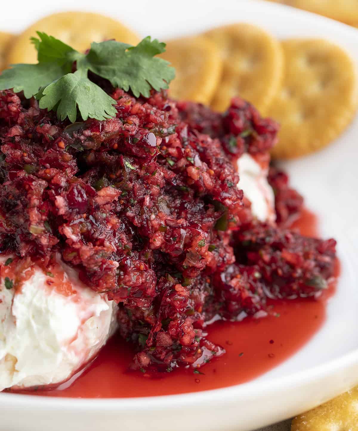 Cranberry Salsa Spilling Over Cream Cheese