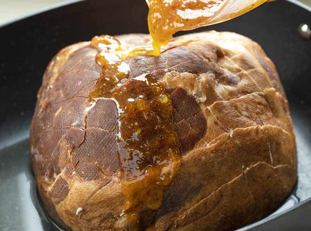 Pouring Apricot Honey Glaze on Ham