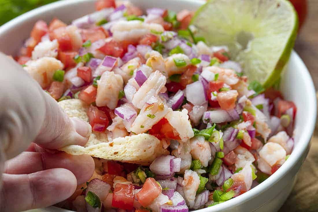 Hand Holding Chip for Shrimp Ceviche