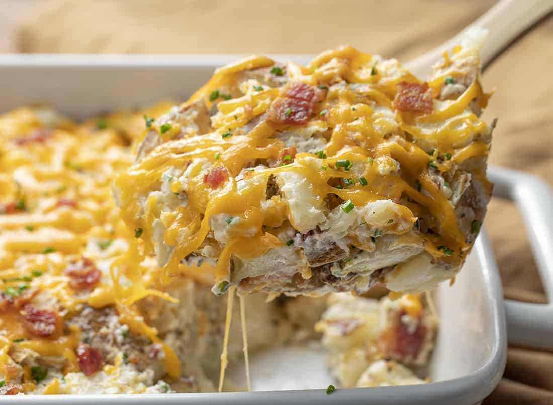 Spoon Picking up Twice Baked Potato Casserole from Pan