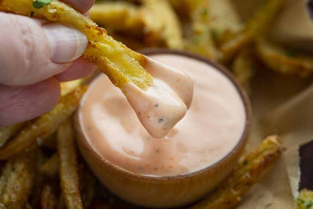 Dipping French Fries into Fry Sauce 