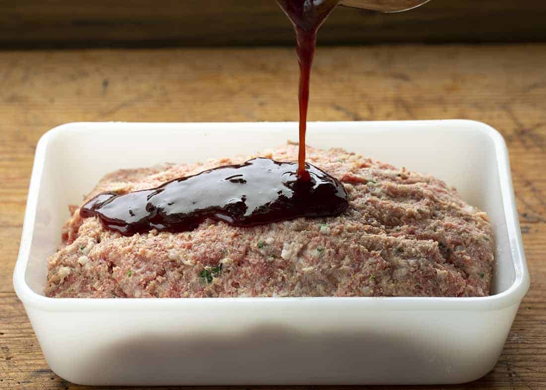 Pouring Sauce over Honey BBQ Meatloaf