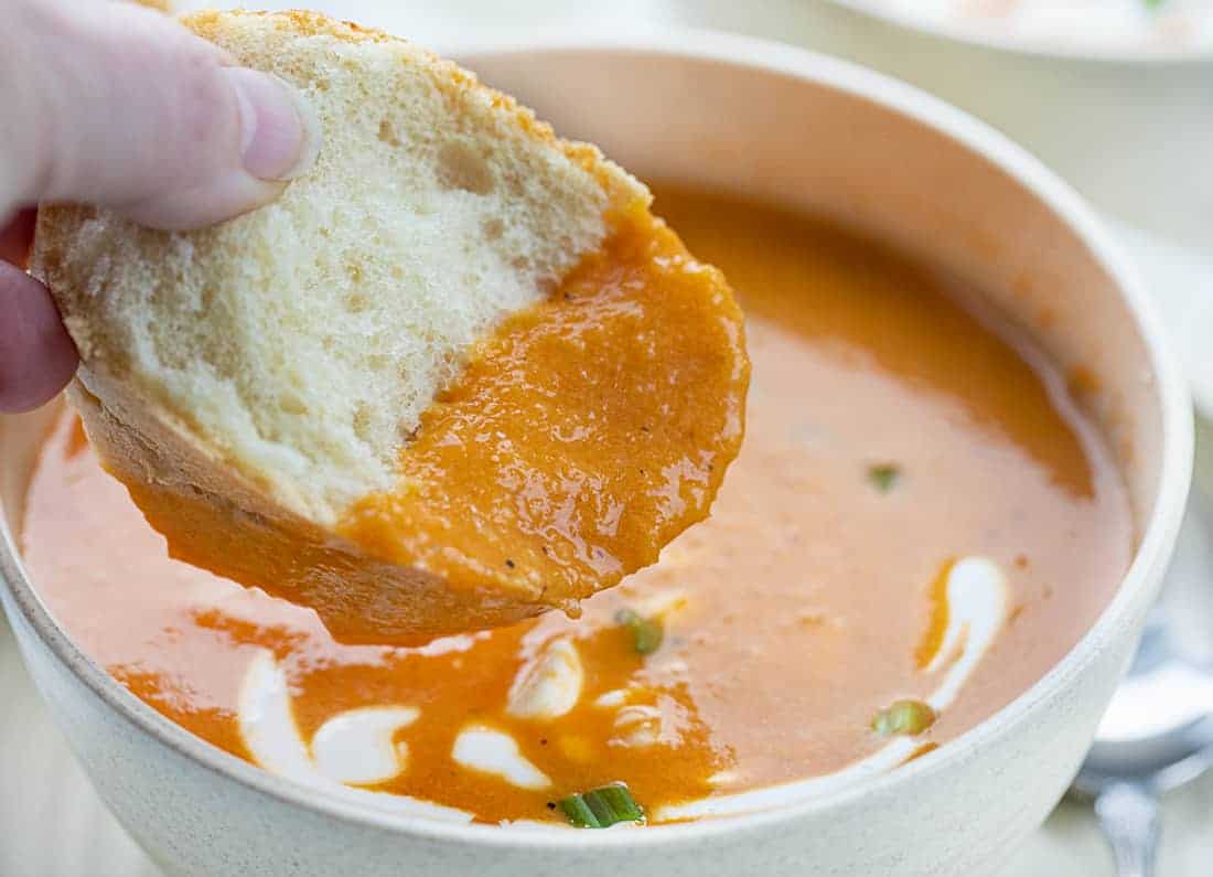 Dipping Bread into Roasted Red Pepper Soup