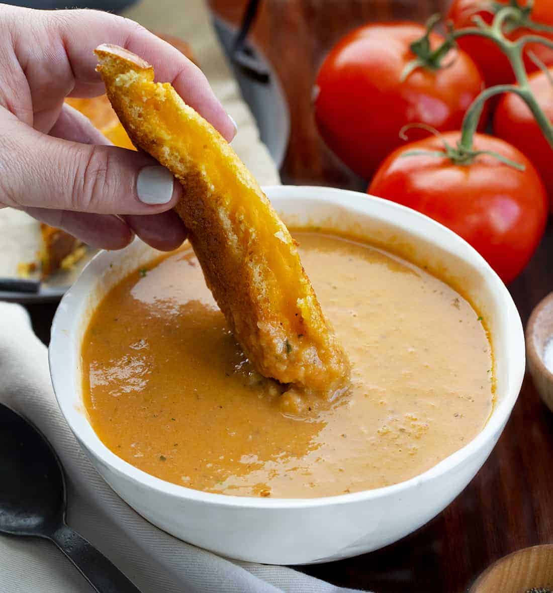 Dipping Grilled Cheese Into Air Fryer Roasted Tomato Soup Recipe