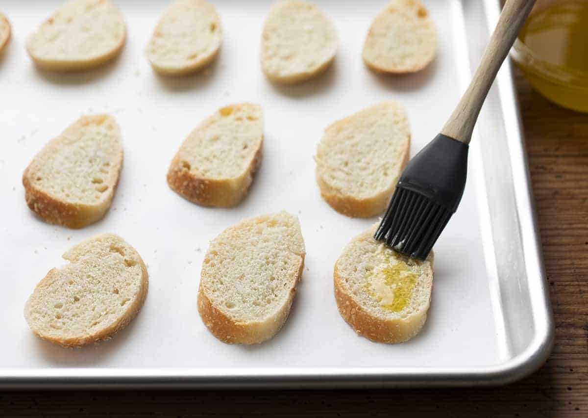 Adding butter to Toasted Baguette - Crostini