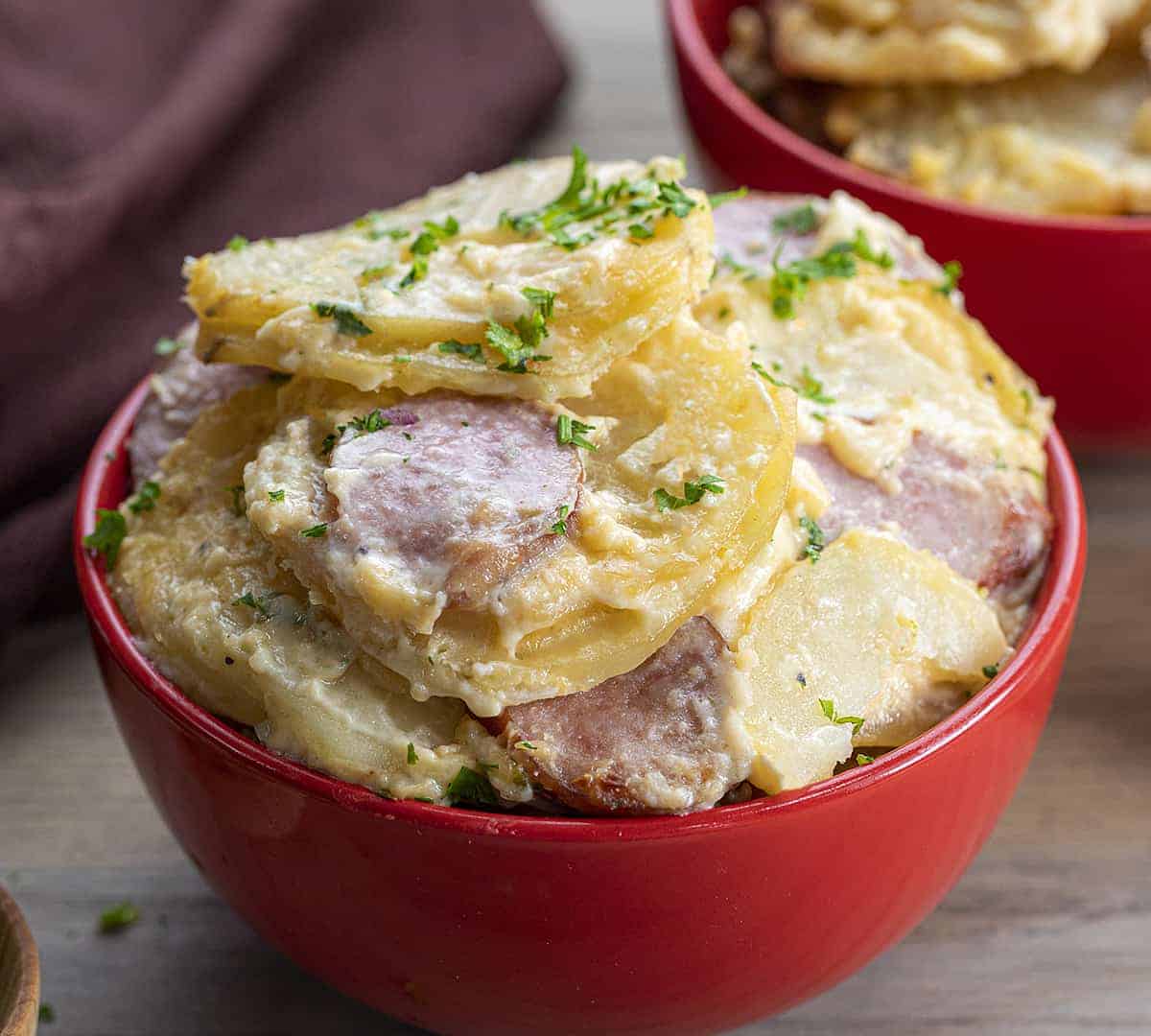 Bowl of Potatoes Au Gratin with Smoked Sausage