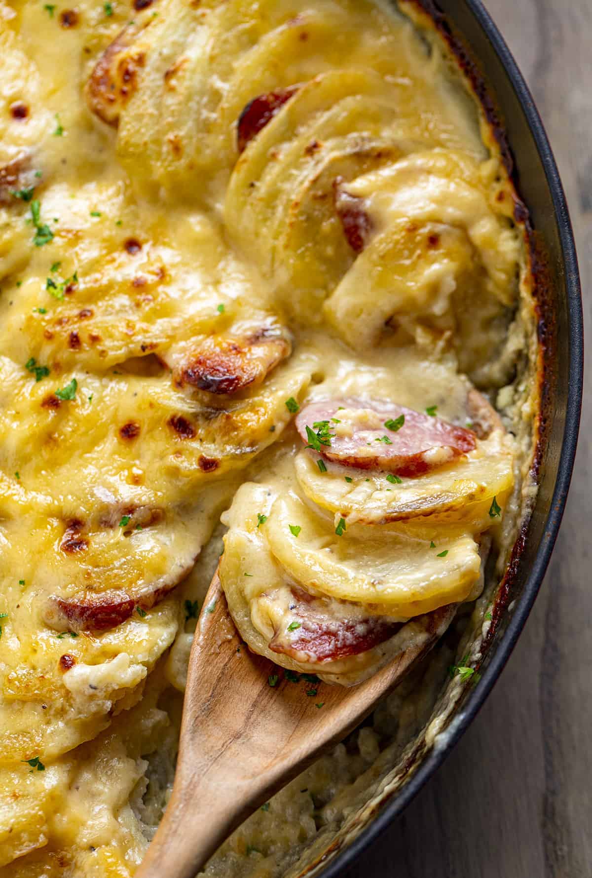 Spoonful of Potatoes Au Gratin with Smoked Sausage 