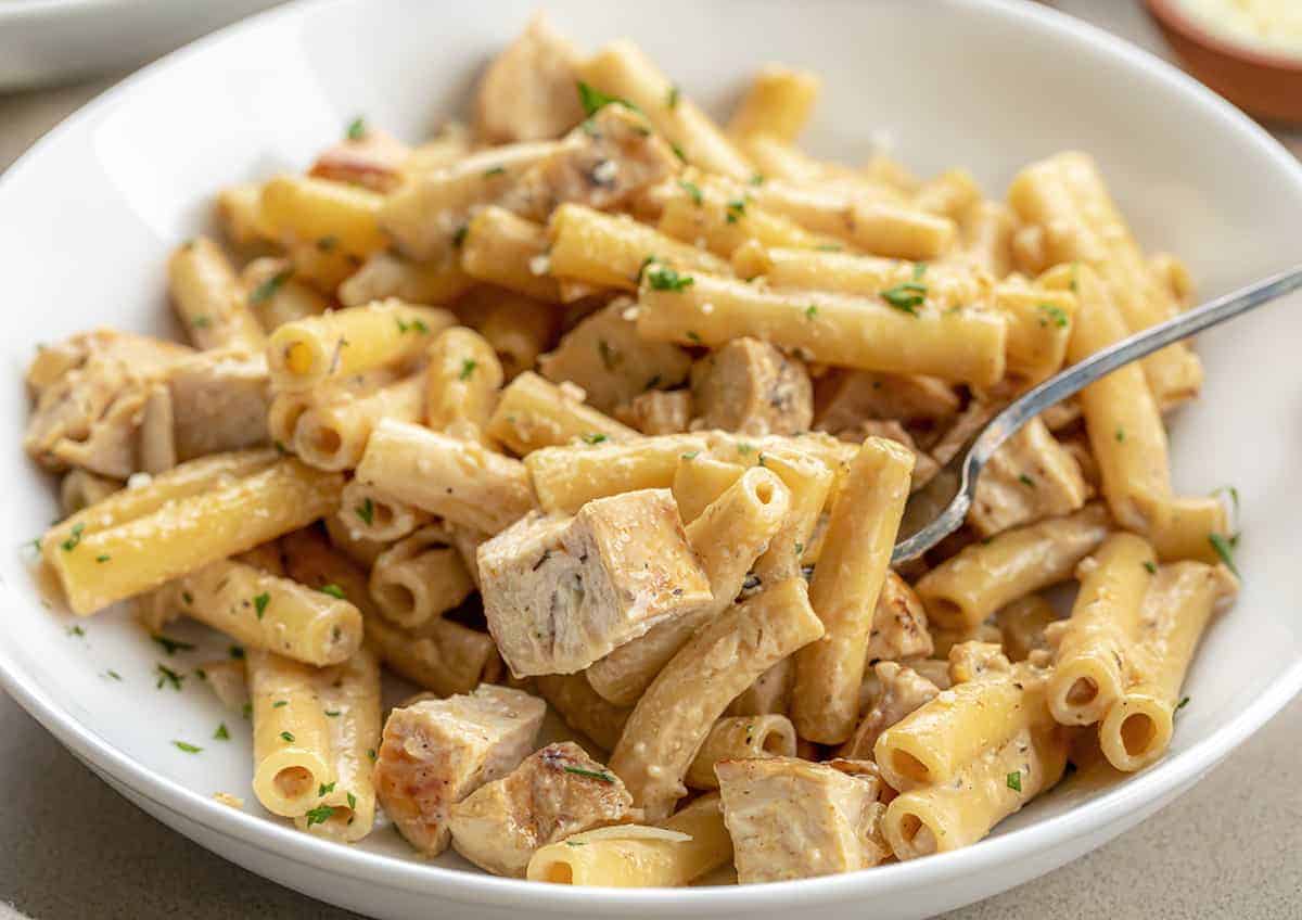 Cajun Chicken Pasta on a Fork in a Bowl
