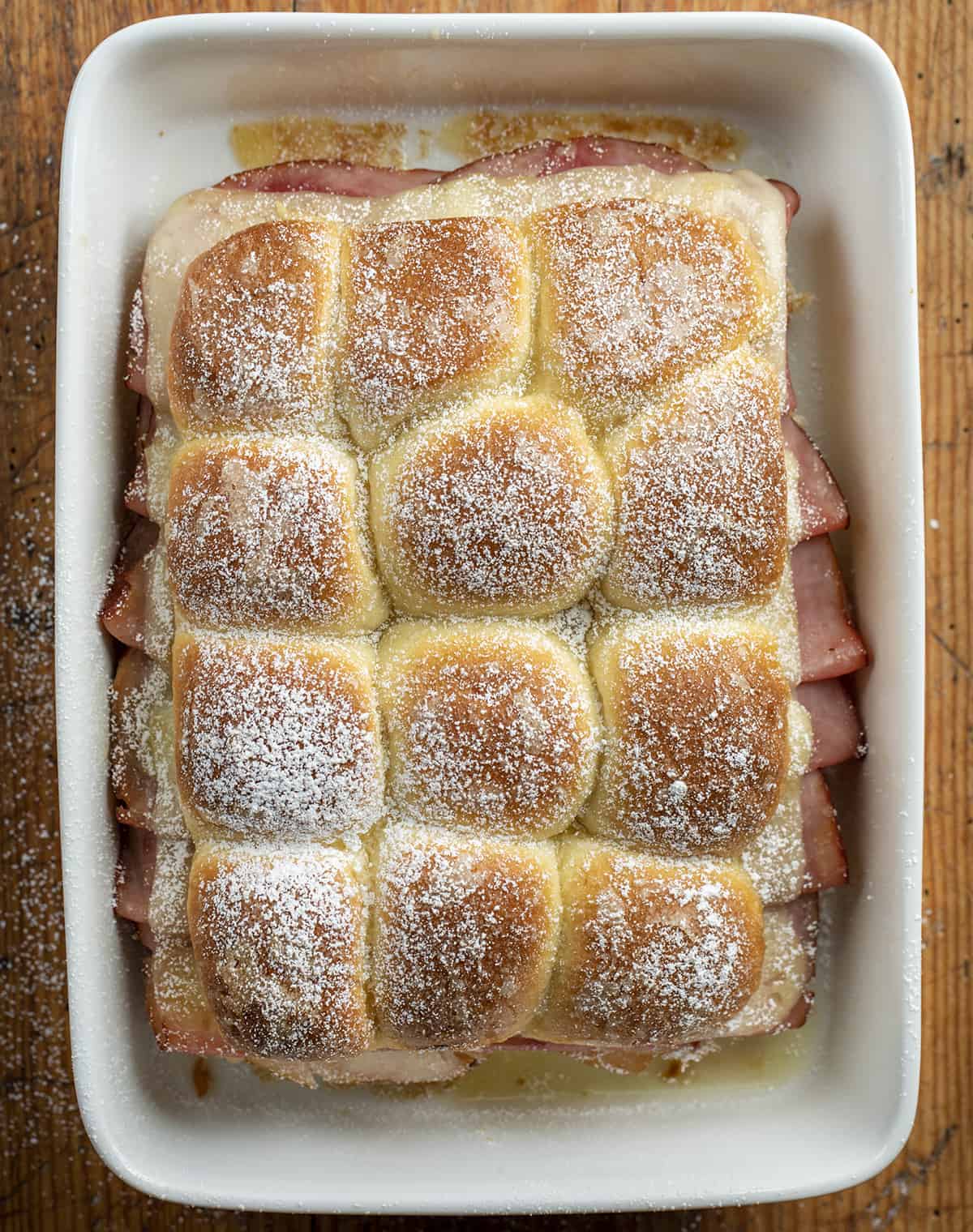 Overhead of a pan of Monte Cristo Sliders Dusted with Confectioners Sugar