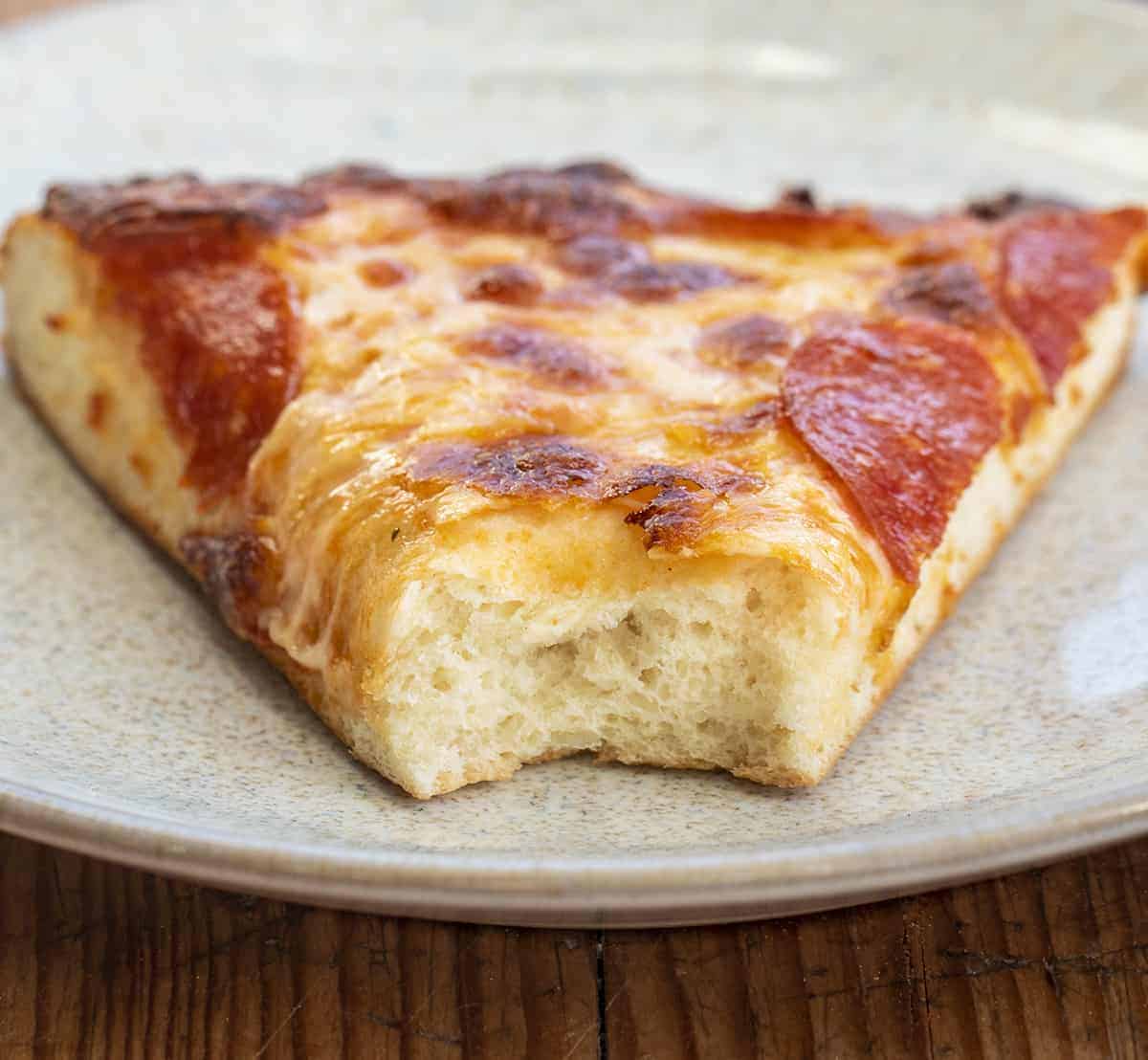 Piece of Pizza Showing Pizza Dough