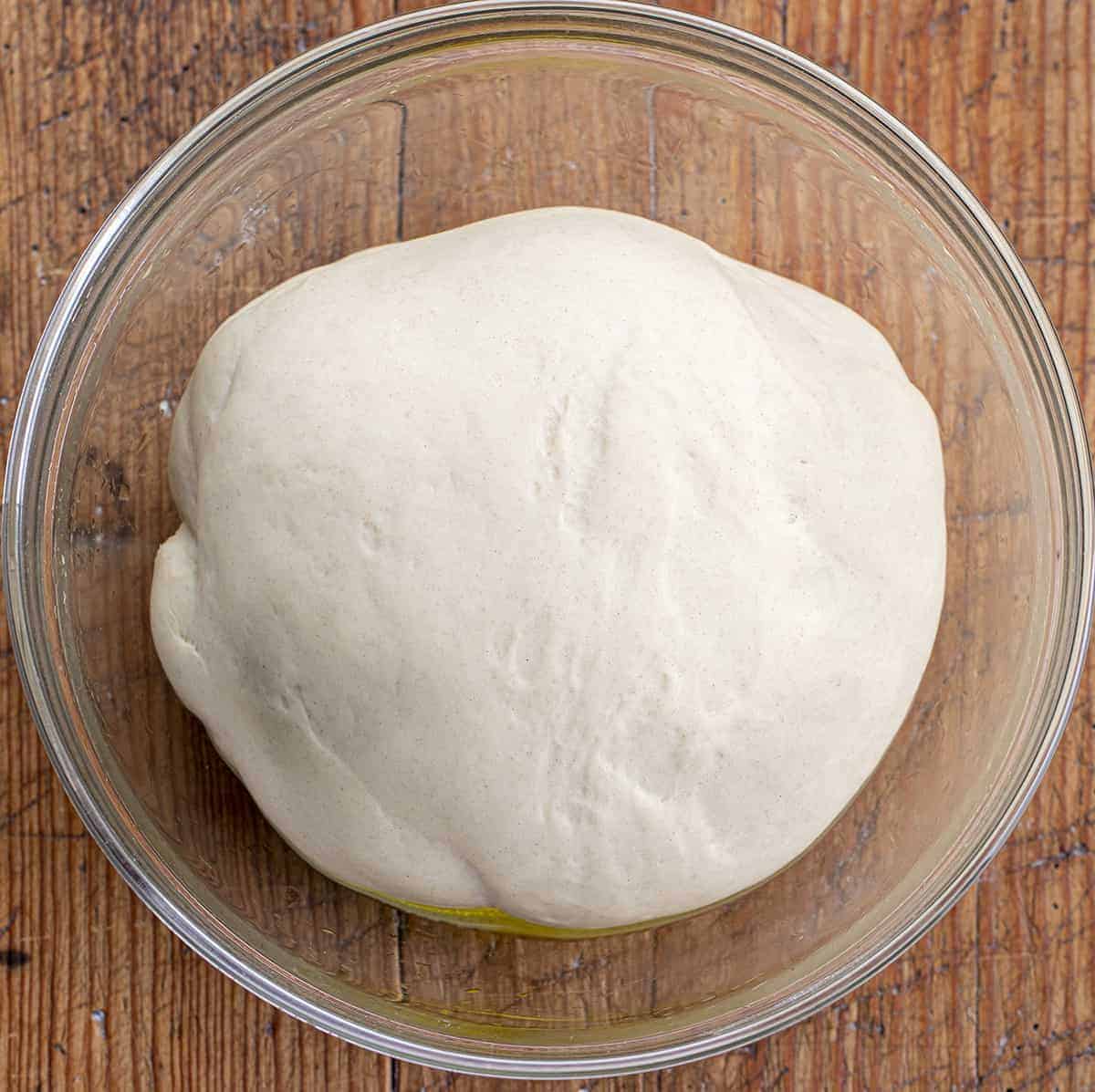 Risen Homemade Pizza Dough in a Bowl