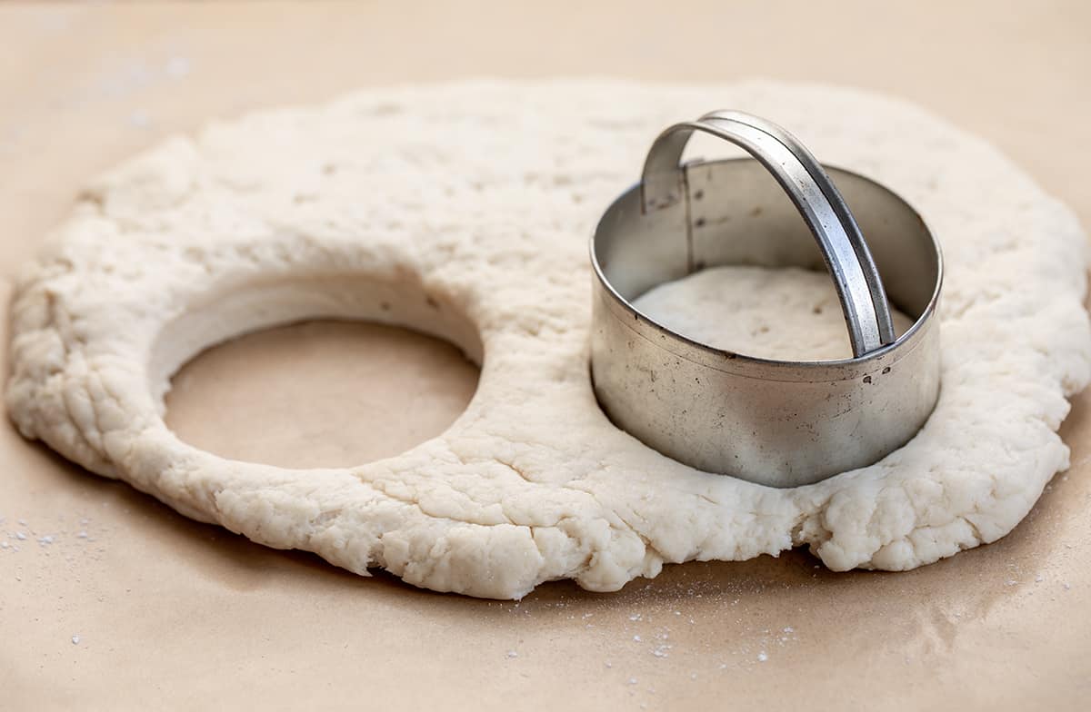 Using cookie Cutter to Cut Out Buttermilk Biscuits.