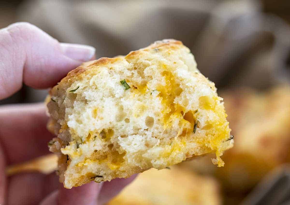 Hand Holding Cheesy Butter Swim Biscuits