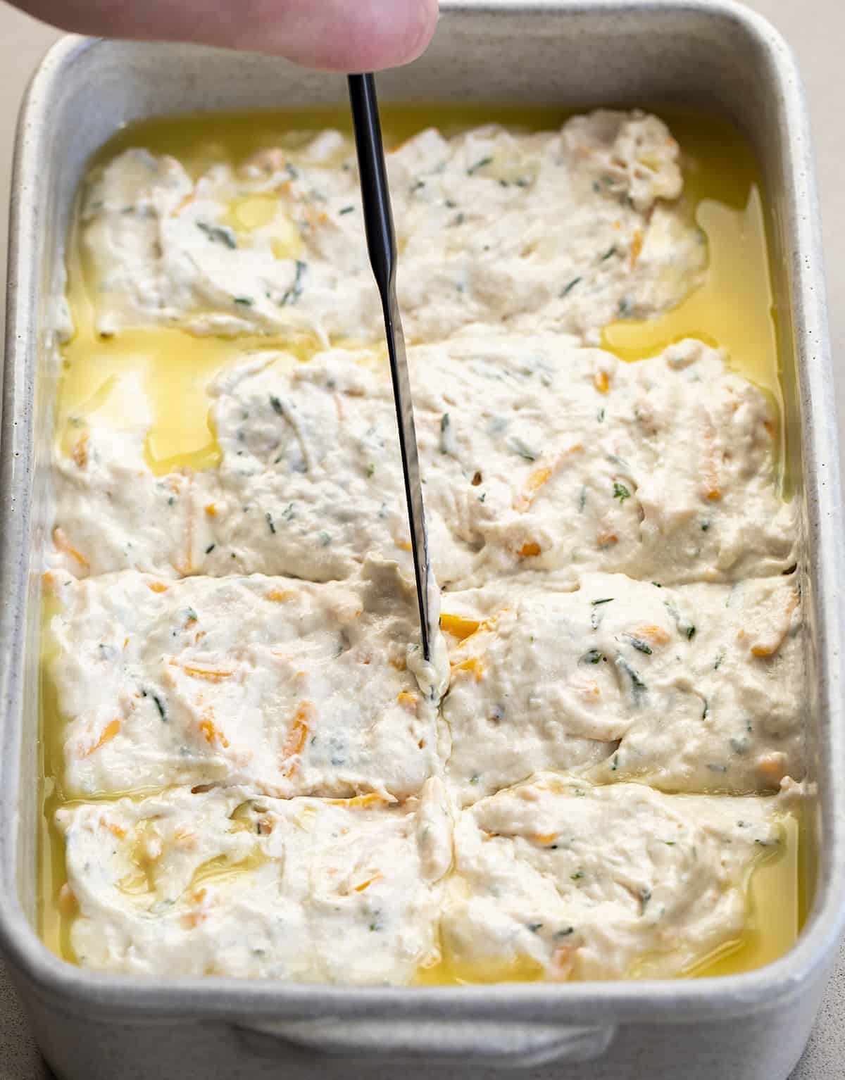 Cutting the Batter Before Baking for Cheesy Butter Swim Biscuits