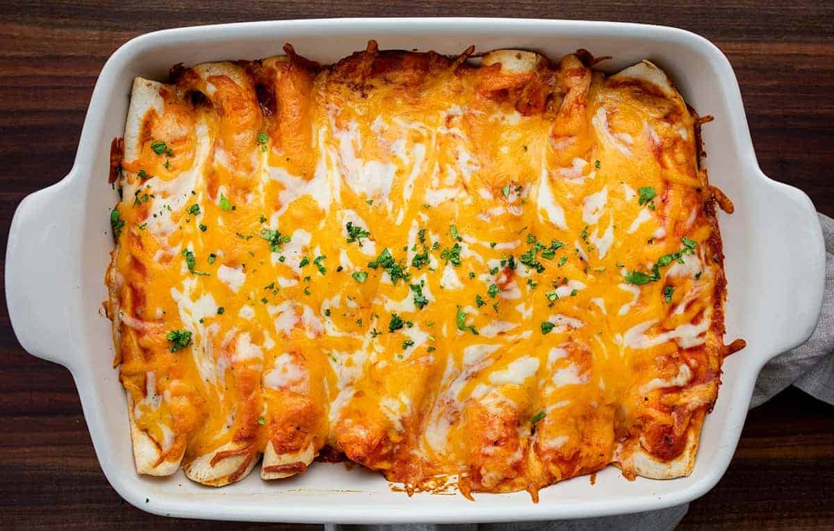 Overhead image of a pan of Chicken Enchiladas covered in cheese