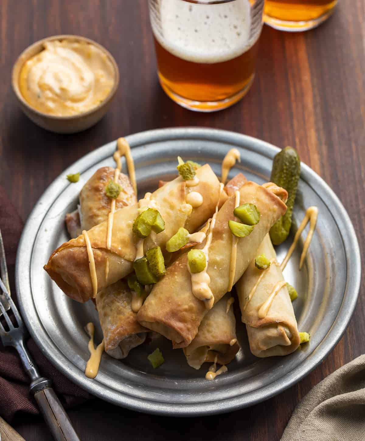 Plate of Air Fryer Dill Pickle Eggrolls with Beer