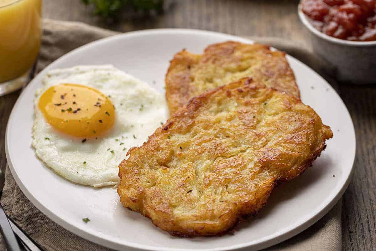 Plate with Homemade Hash Brown Patties and an Egg for Breakfast