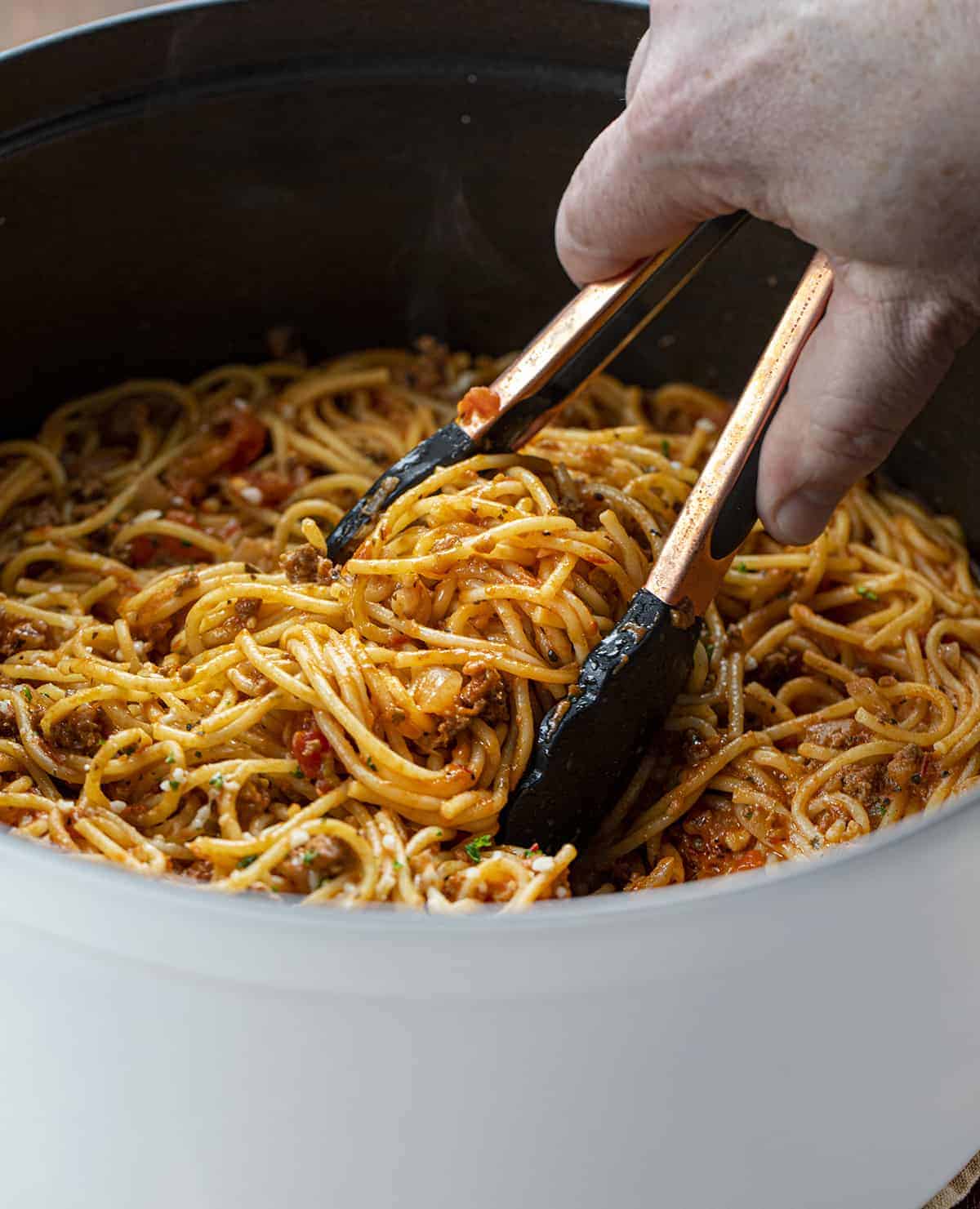 Tongs Picking up a Big Amount of One Pot Spaghetti