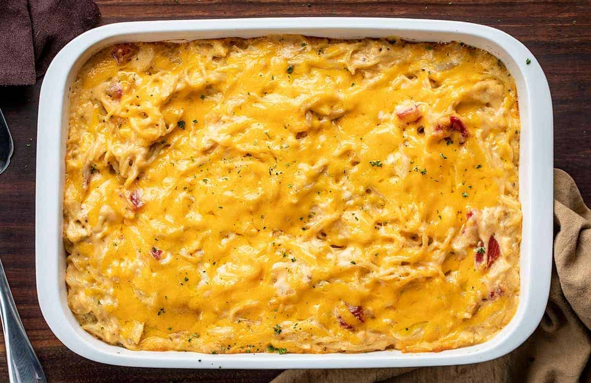 Casserole Dish of Chicken Spaghetti Mac and Cheese on Cutting Board. 