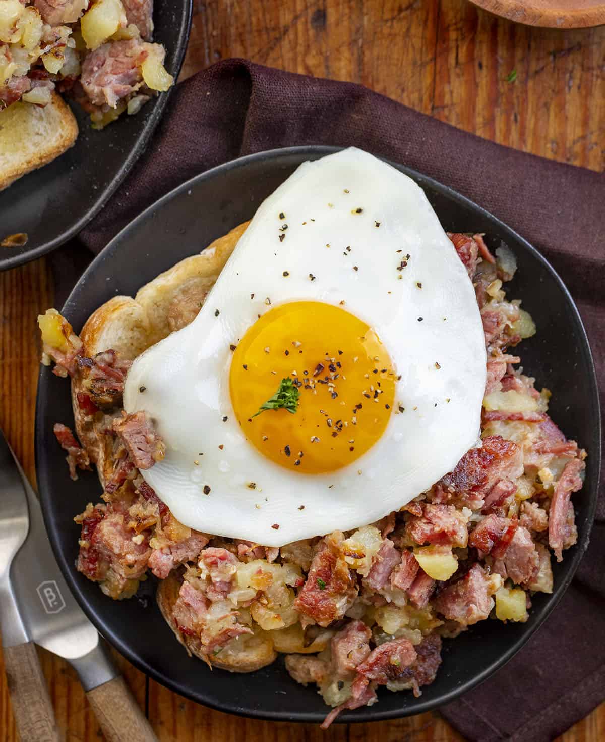 Plate of Corned Beef Hash with Over Medium Egg on Top