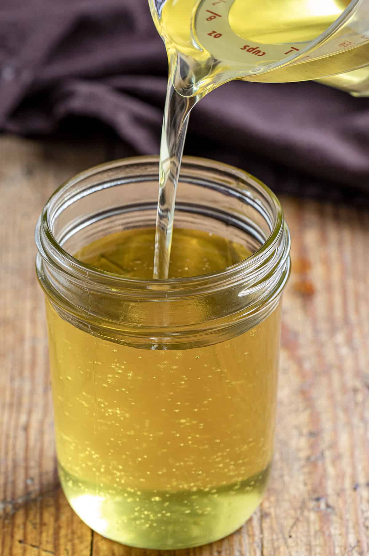 Pouring Clarified Oil into Jar. How to Clean Used Cooking Oil.