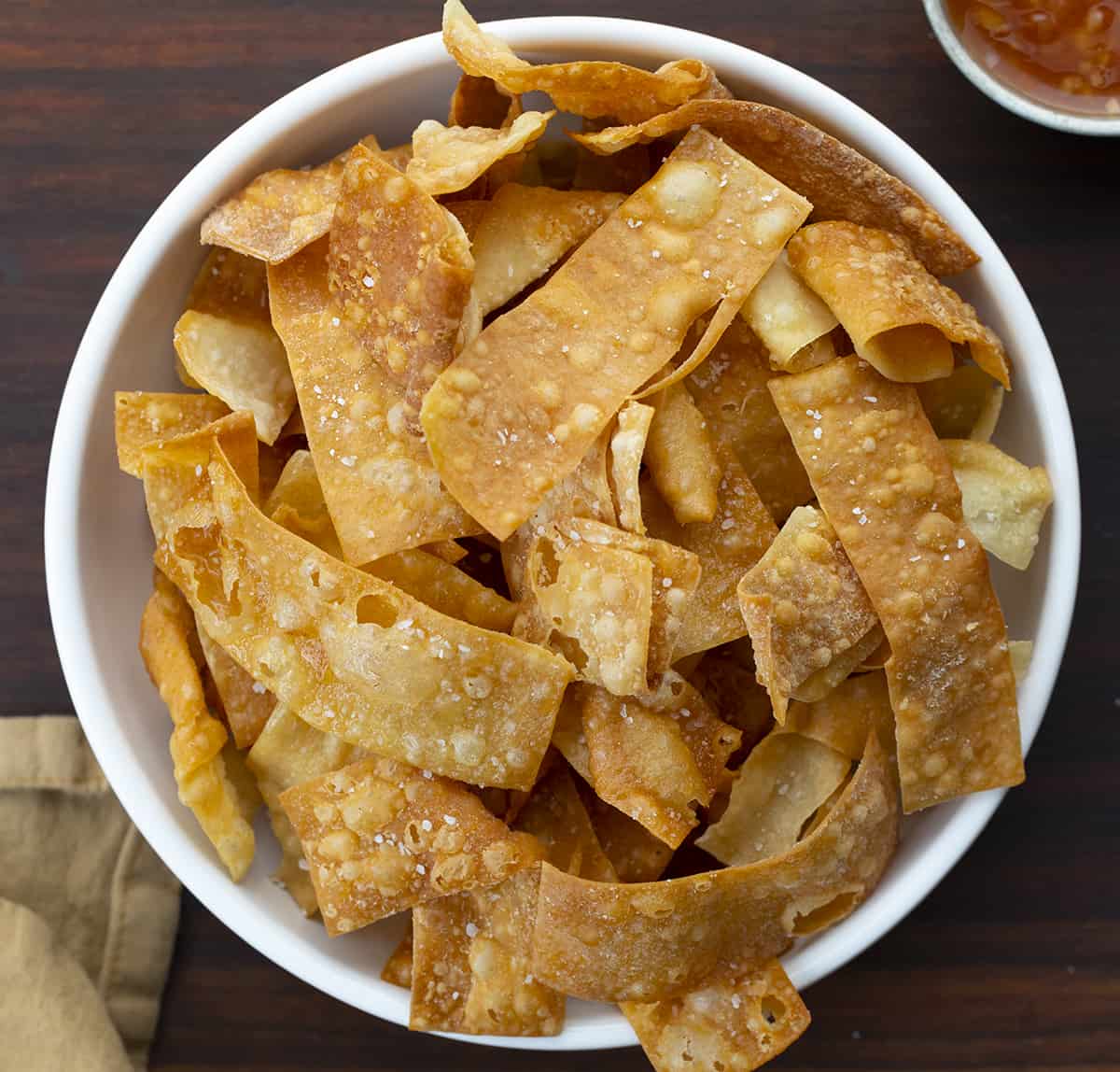 Fried Wonton Strips in a Bowl. Wontons, Wonton Strips, Wonton Chips, Fried Wonton Chips, Oven Baked Wonton Chips, Crispy Wonton Chips, Fried Wontons, Asian Inspired Wonton Chips, recipes, i am homesteader, iamhomesteader