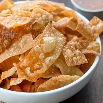 Bowl of Fried Wonton Strips. Wontons, Wonton Strips, Wonton Chips, Fried Wonton Chips, Oven Baked Wonton Chips, Crispy Wonton Chips, Fried Wontons, Asian Inspired Wonton Chips, recipes, i am homesteader, iamhomesteader