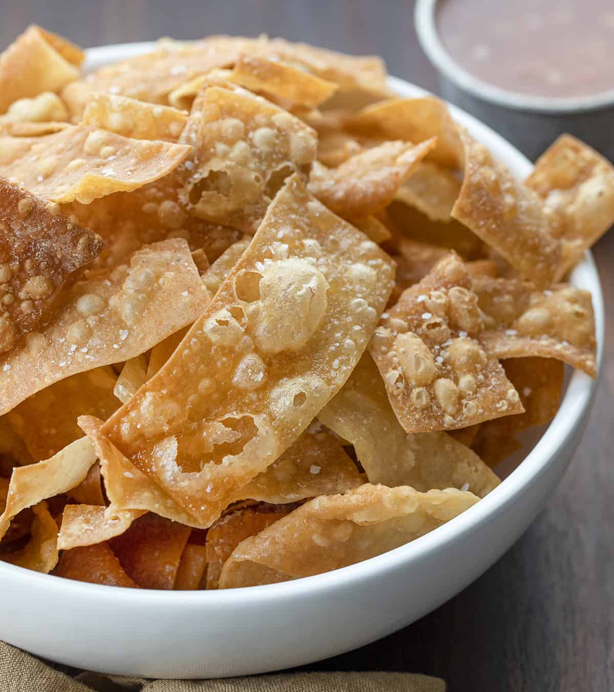 Bowl of Fried Wonton Strips. Wontons, Wonton Strips, Wonton Chips, Fried Wonton Chips, Oven Baked Wonton Chips, Crispy Wonton Chips, Fried Wontons, Asian Inspired Wonton Chips, recipes, i am homesteader, iamhomesteader