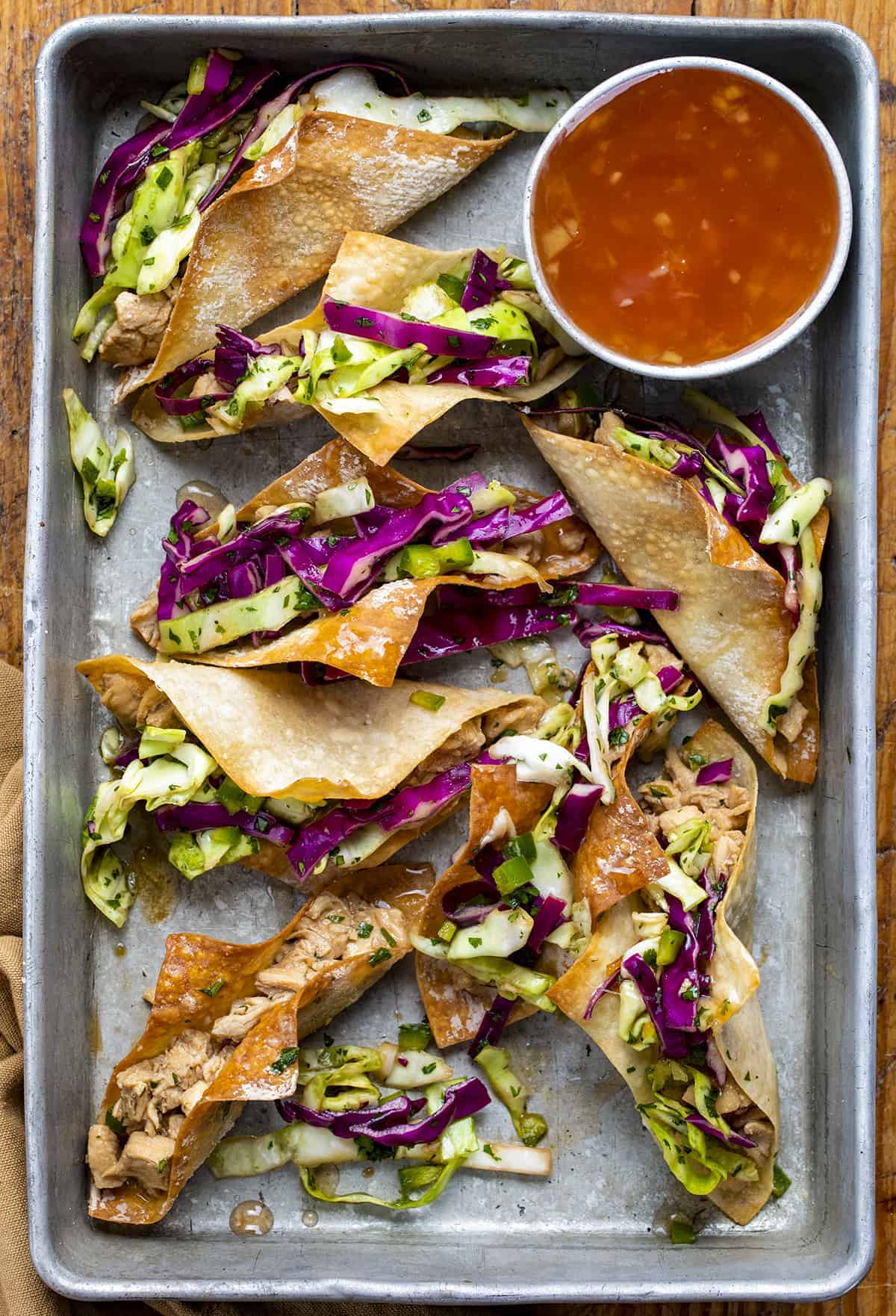 Pan of Chicken Wonton Tacos with Sweet Chili Sauce from Overhead.