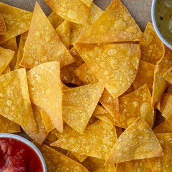 Close up of homemade Tortilla Chips with salsa and tomatillo sauce.