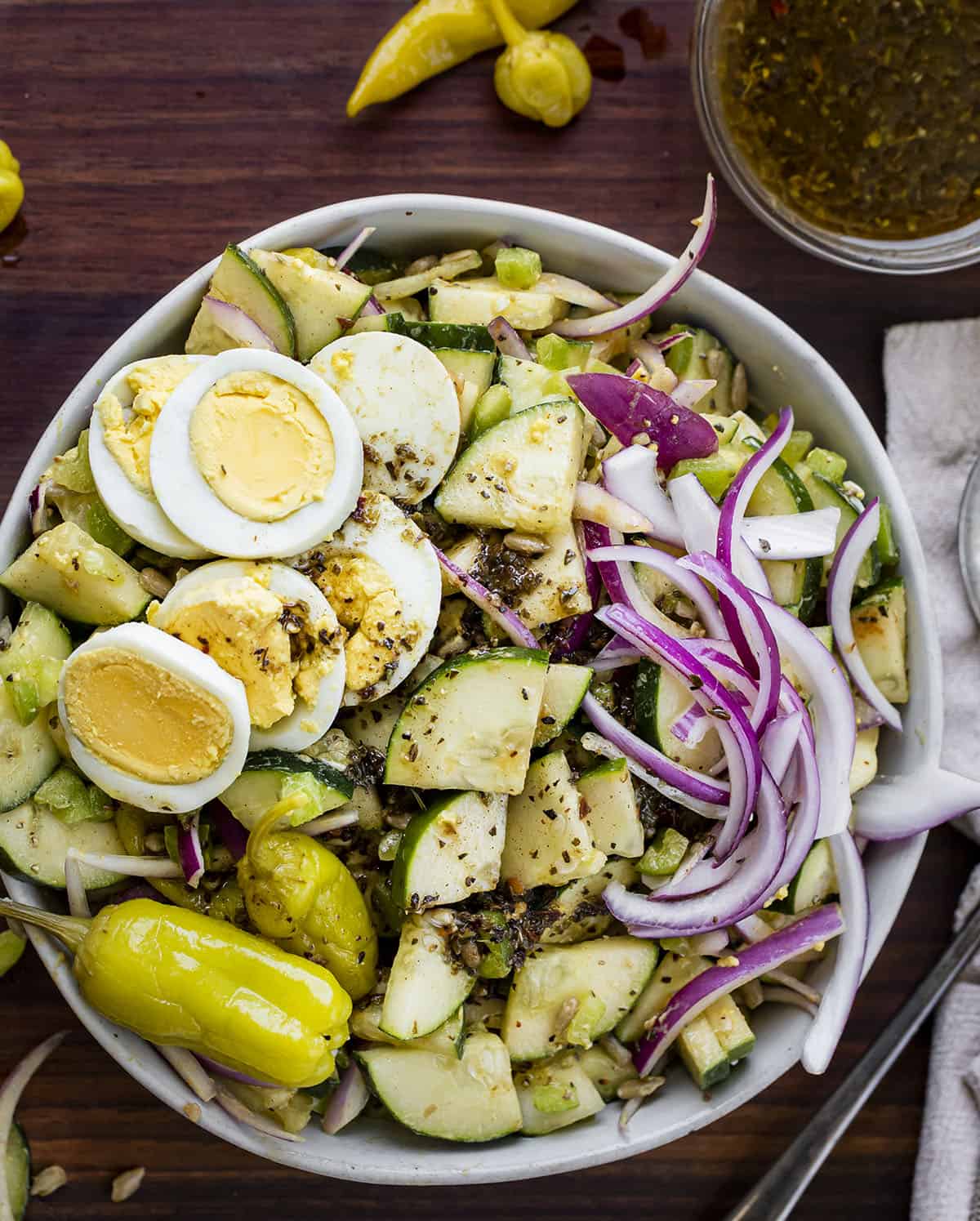 Hot Girl Salad in a Bowl with Dressing off to the Side From Overhead