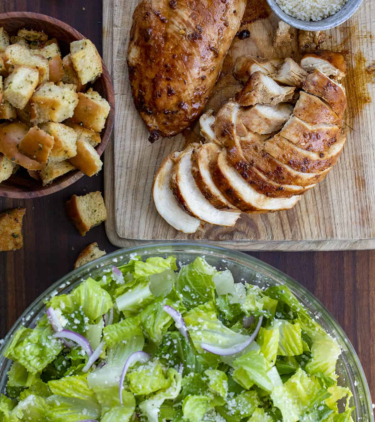 Sliced Chicken, Homemade Croutons, and Lettuce with Onions before Assembling to Make Lemon Parmesan Chicken Salad. Salad, Summer Salad, Viral Salad, TikTok Viral Salad, Tiktok Salad, Lemon Salad, Lemon Garlic Salad, Summer Meals, Dinner, Lunch, i am homesteader, iamhomesteader.