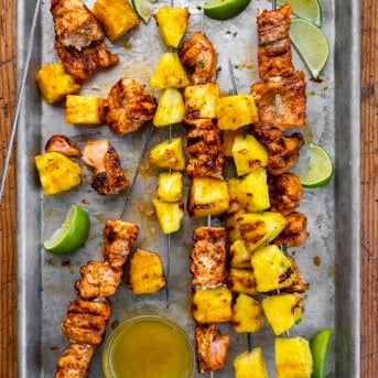 Pineapple Salmon Kebabs on Skewers on a Tray with Lime Oil and Limes. Dinner, Kebabs, Salmon Kebabs, Pineapple Kebabs, Grilling, Air Fryer Kebabs, Oven Kebabs, Seafood Kebabs, Summer Kebabs, How to Make Kebobs, recipes, i am homesteader, iamhomesteader