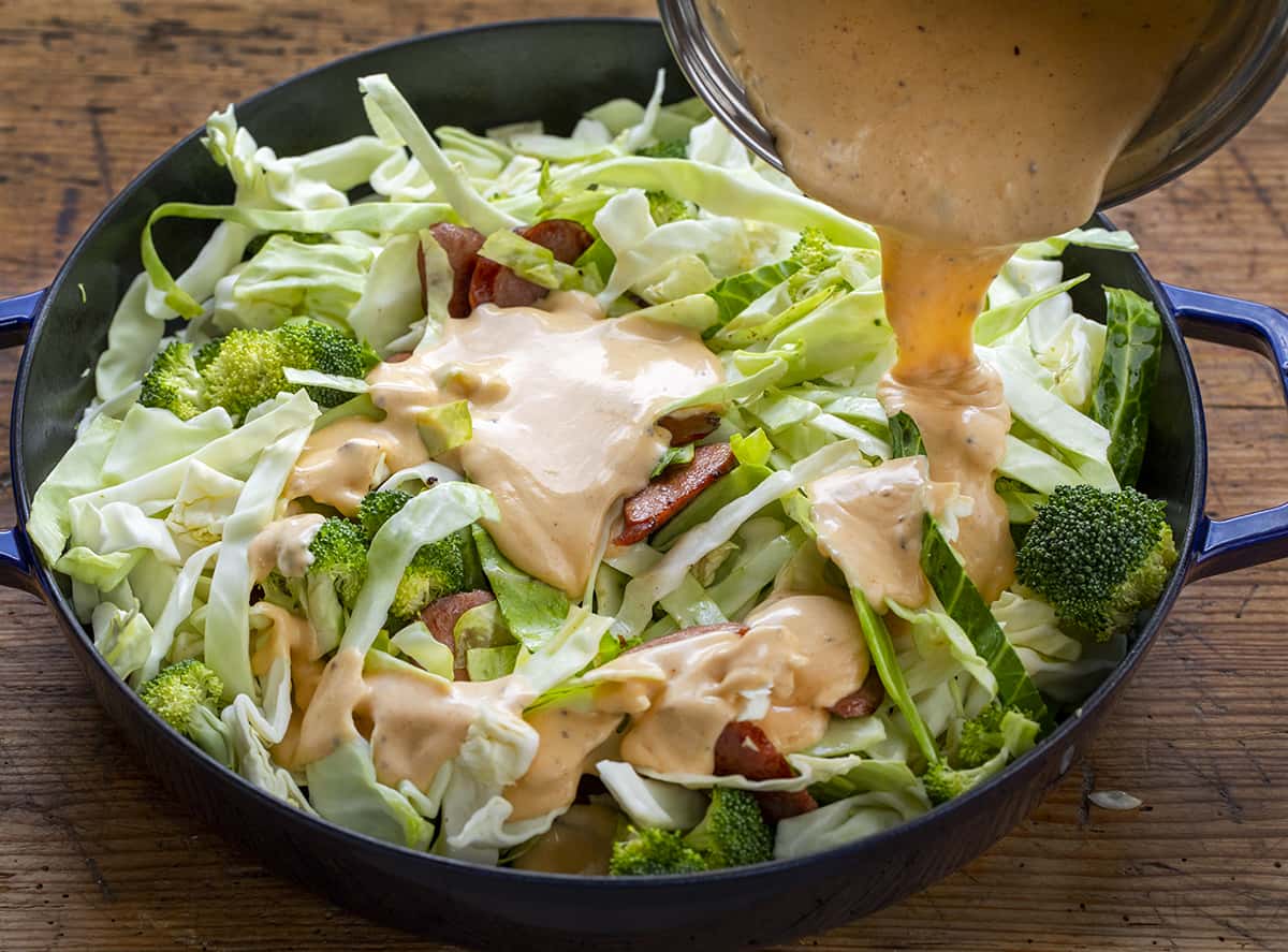Pouring Cheese Sauce Over Lettuce for Sausage Bake. Dinner, Cabbage Recipes, Fried Cabbage, Sausage and Cabbage, Polish Sausage Recipes, Summer Sausage Recipes, Kielbasa Recipes, i am homesteader, iamhomesteader
