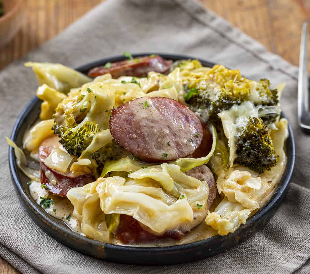 Plate of Cheesy Sausage Cabbage Broccoli Bake. Dinner, Cabbage Recipes, Fried Cabbage, Sausage and Cabbage, Polish Sausage Recipes, Summer Sausage Recipes, Kielbasa Recipes, i am homesteader, iamhomesteader