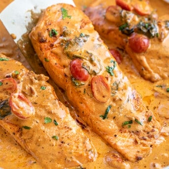 Spatula Holding up Creamy Tuscan Salmon. Salmon Recipes, Dinner, Supper, How to Cook Salmon, Comfort Food, dinner recipes, salmon tuscan, i am homesteader, iamhomesteader.