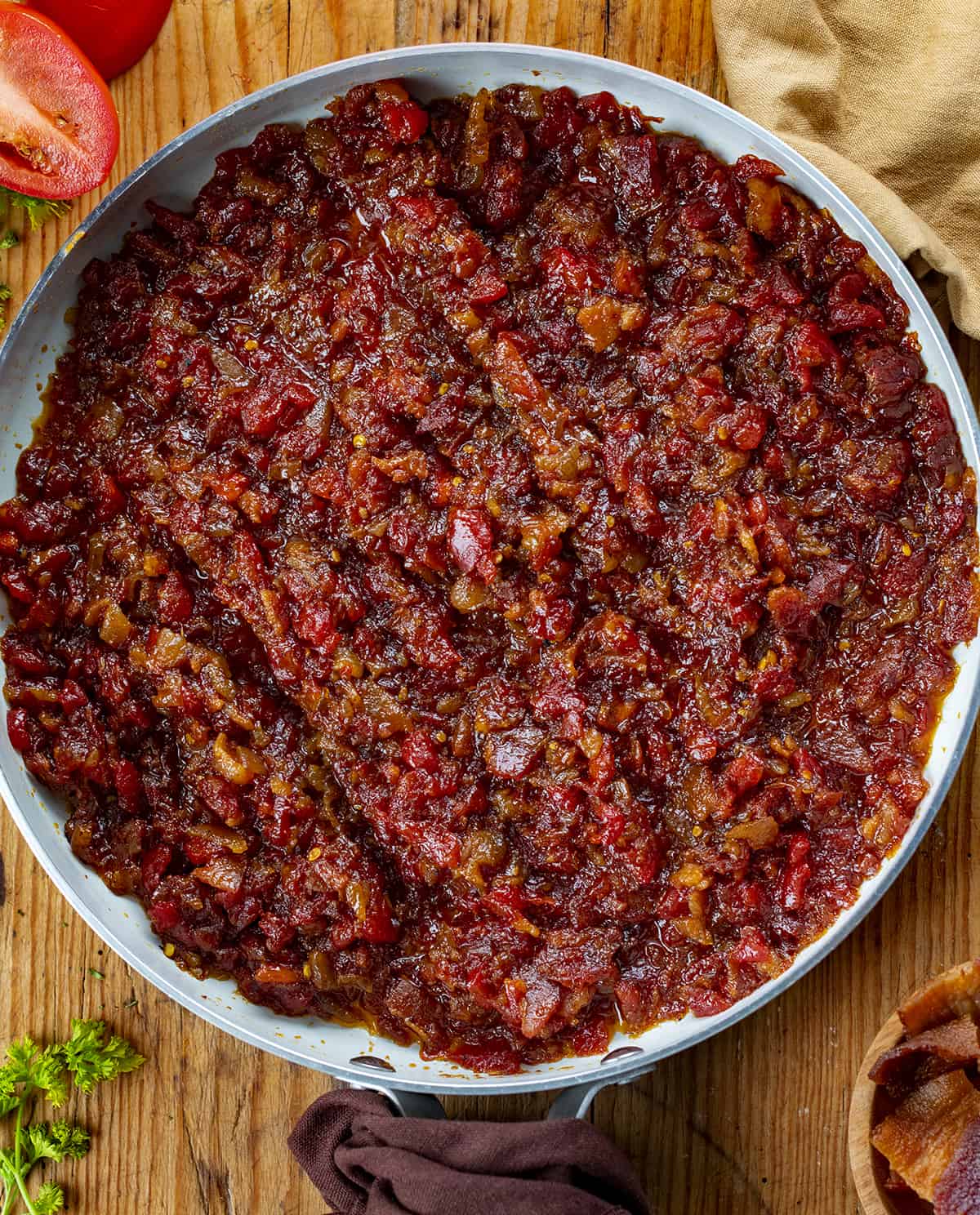 Skillet Filled with Cooked Tomato Bacon Jam. Jam, Bacon Jam, Tomato Bacon Jam, Bacon Marmalade, Bacon Jam Recipe, Appetizer, Super Bowl Appetizer, Game Day Food, Best Appetizers, Best Burger Toppings, i am homesteader, iamhomesteader