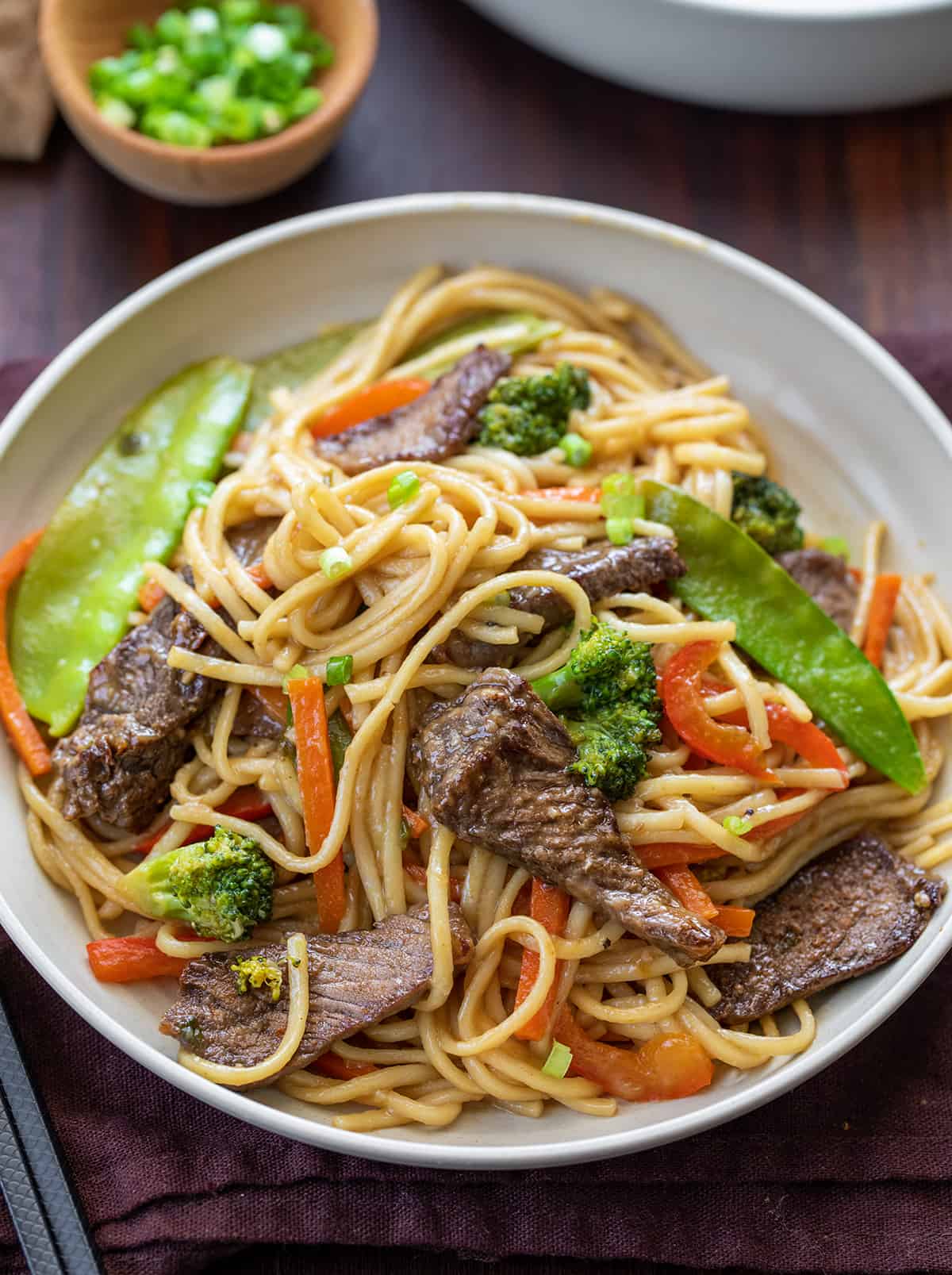 Plate of Beef Lo Mein on a Dark Napkin.